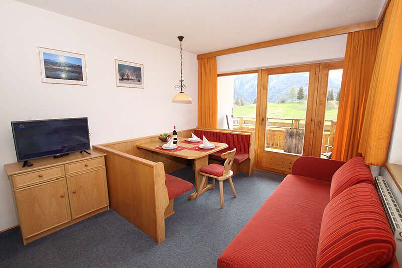 Living area with view of the balcony in apartment 2